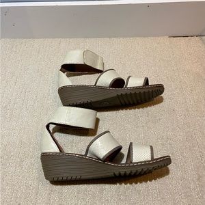 Cream leather wedge sandal.